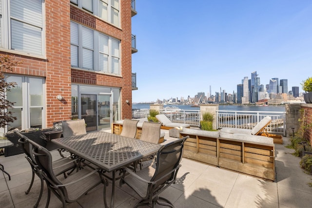 1125 Maxwell Ln Unit 654, Hoboken, NJ 07030 - view of patio / terrace featuring outdoor dining area, a water view, and a skyline view