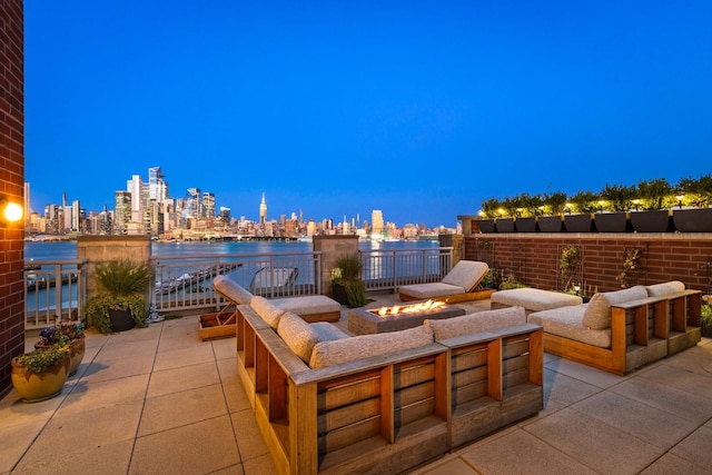 1125 Maxwell Ln Unit 654, Hoboken, NJ 07030 - view of patio / terrace with a fire pit, a skyline view, and a water view