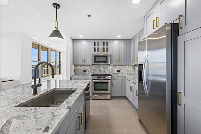 1125 Maxwell Ln Unit 654, Hoboken, NJ 07030 - kitchen with appliances with stainless steel finishes, a sink, gray cabinets, backsplash, and recessed lighting