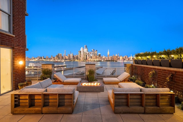 1125 Maxwell Ln Unit 654, Hoboken, NJ 07030 - view of patio / terrace featuring an outdoor living space with a fire pit, a water view, and a view of skyline