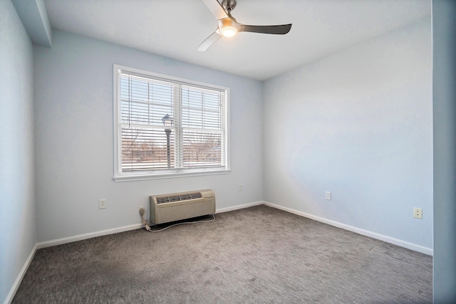 carpeted empty room with baseboards, a wall mounted air conditioner, and a ceiling fan