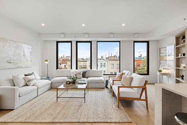 living room featuring recessed lighting and light wood finished floors