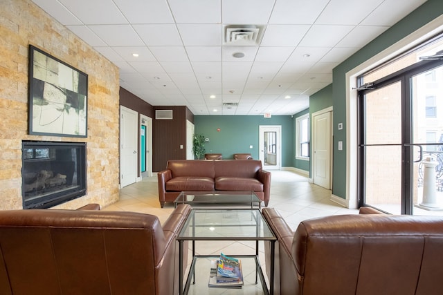 96 Tidewater St Unit 1G, Jersey City, NJ 07302 - tiled living room featuring a fireplace, recessed lighting, a drop ceiling, and baseboards