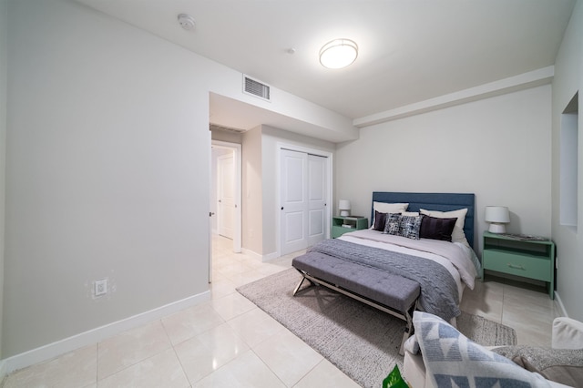 96 Tidewater St Unit 1G, Jersey City, NJ 07302 - bedroom with light tile patterned floors, a closet, and baseboards