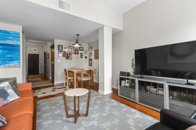 187 Wayne St Unit C405, Jersey City, NJ 07302 - living room featuring wood finished floors and baseboards