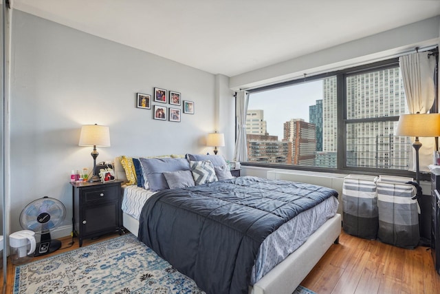 bedroom featuring wood-type flooring