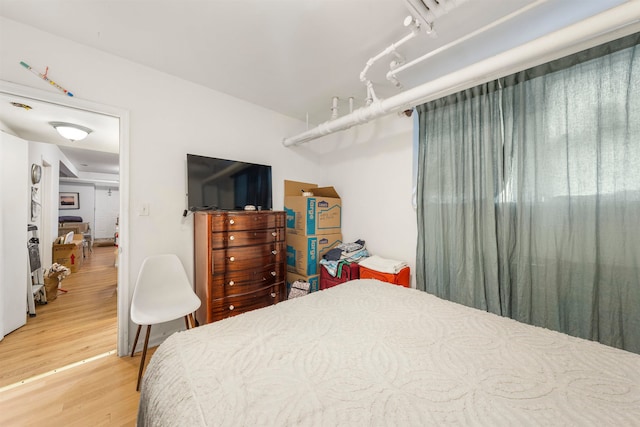 bedroom featuring hardwood / wood-style flooring