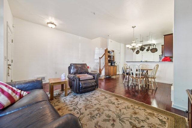 265 Custer Ave Unit 103, Jersey City, NJ 07305 - living area with hardwood / wood-style flooring, a chandelier, and stairway