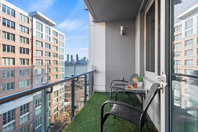 balcony with a city view and a water view