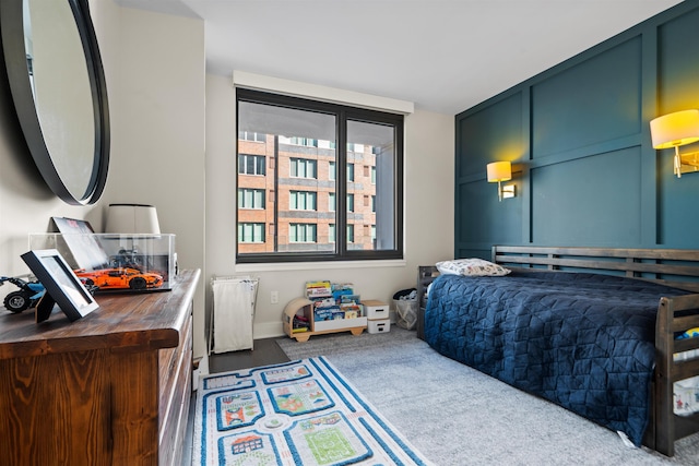 bedroom featuring dark colored carpet