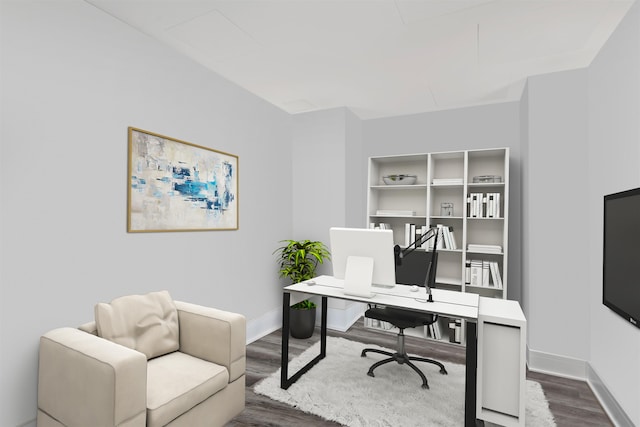 office featuring baseboards and wood finished floors