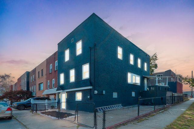 view of outdoor building at dusk