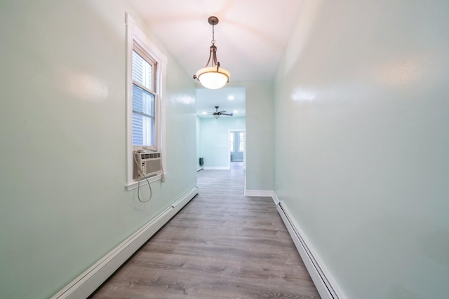 259 Griffith St Unit 1, Jersey City, NJ 07307 - hall featuring a baseboard heating unit, baseboards, wood finished floors, and cooling unit