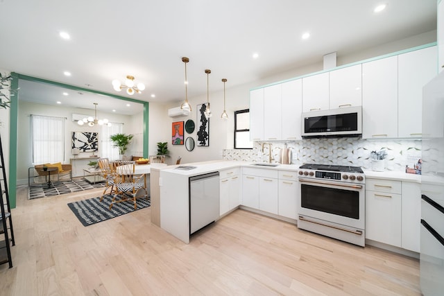 166 Steuben St Unit 1A, Jersey City, NJ 07302 - kitchen featuring white microwave, gas stove, stainless steel dishwasher, a sink, and backsplash