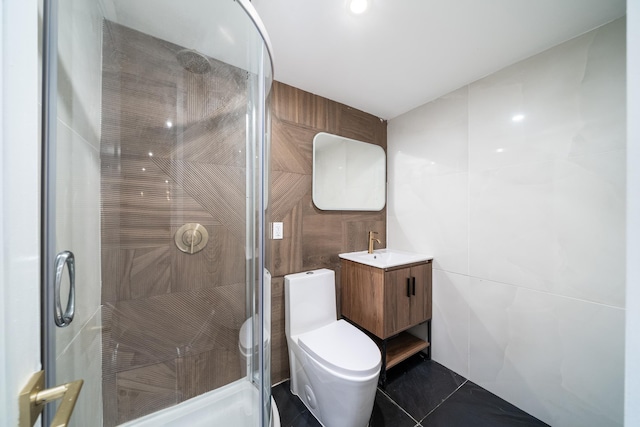 166 Steuben St Unit 1A, Jersey City, NJ 07302 - bathroom with tile walls, toilet, a stall shower, vanity, and tile patterned flooring