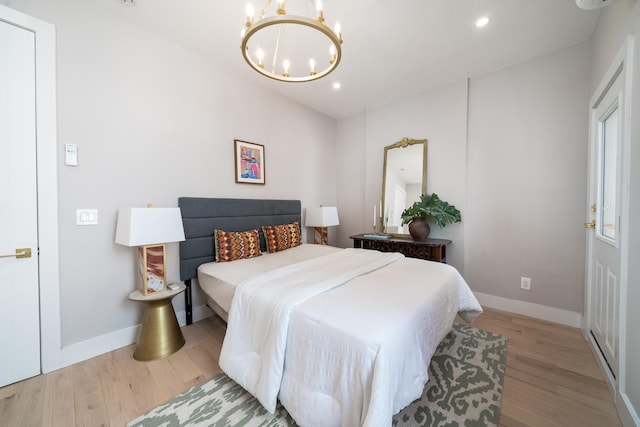 166 Steuben St Unit 1A, Jersey City, NJ 07302 - bedroom with a chandelier, wood finished floors, recessed lighting, and baseboards