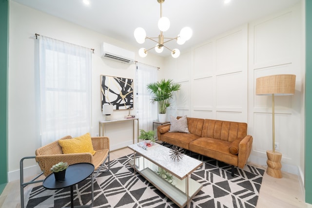 166 Steuben St Unit 1A, Jersey City, NJ 07302 - living room with a wall mounted AC, a decorative wall, a chandelier, and light wood-type flooring