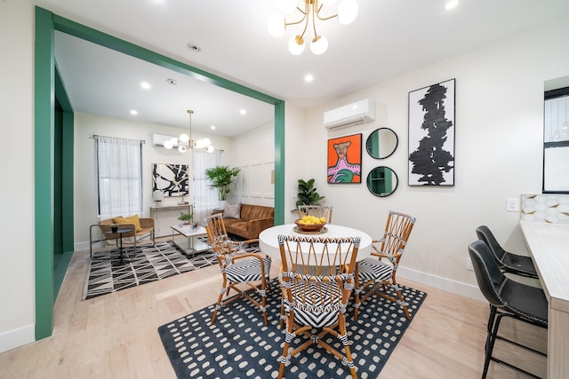 166 Steuben St Unit 1A, Jersey City, NJ 07302 - dining room featuring a chandelier, a wall mounted air conditioner, wood finished floors, baseboards, and recessed lighting