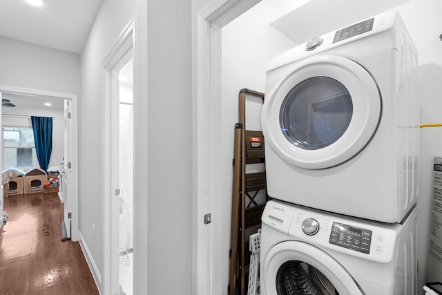 42 Grace St Unit 2A, Jersey City, NJ 07307 - laundry room featuring stacked washer and clothes dryer and wood finished floors