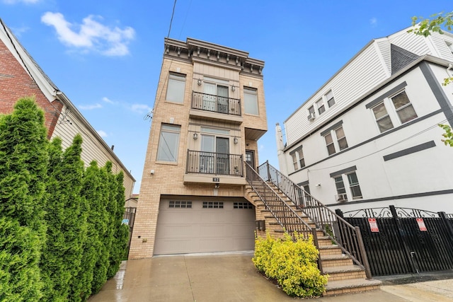 42 Grace St Unit 2A, Jersey City, NJ 07307 - view of building exterior with an attached garage, driveway, and stairway