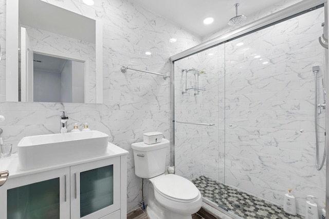 42 Grace St Unit 2A, Jersey City, NJ 07307 - bathroom with a shower stall, tile walls, vanity, and decorative backsplash