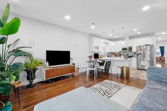 42 Grace St Unit 2A, Jersey City, NJ 07307 - living area featuring wood finished floors and recessed lighting
