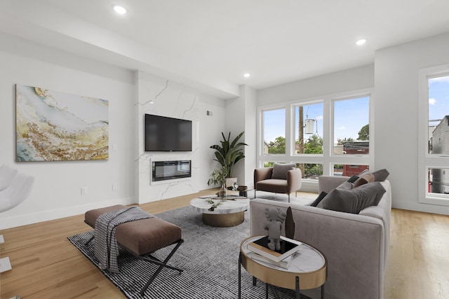 119 Van Horne St Unit 2, Jersey City, NJ 07304 - living room featuring light wood-type flooring, recessed lighting, and a fireplace