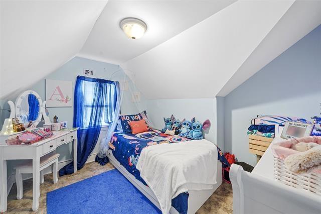 bedroom with vaulted ceiling