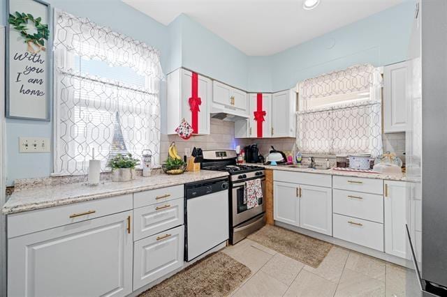 kitchen with dishwasher, white cabinetry, stainless steel range with gas cooktop, and tasteful backsplash