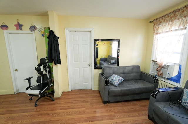 living area with hardwood / wood-style floors