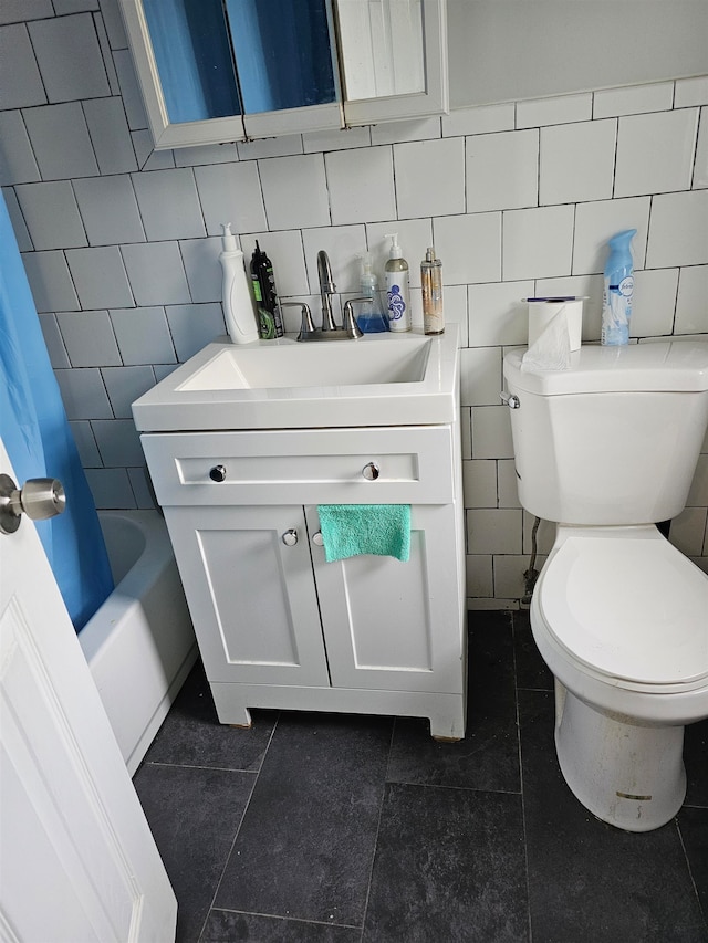 full bathroom with tasteful backsplash, tile patterned flooring, tile walls, toilet, and shower / tub combo