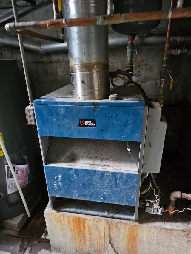 utility room featuring heating unit