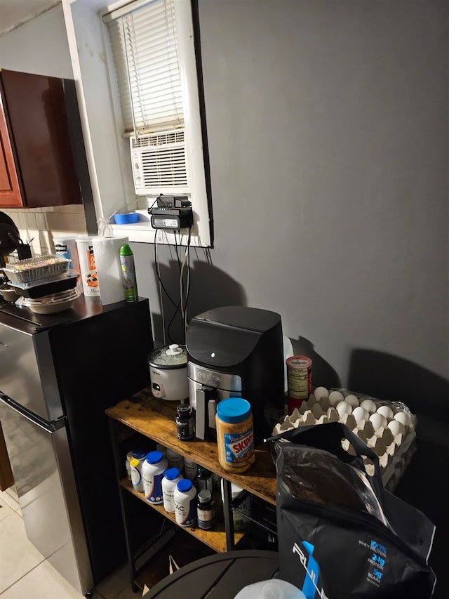 kitchen with stainless steel fridge, cooling unit, and light tile patterned floors