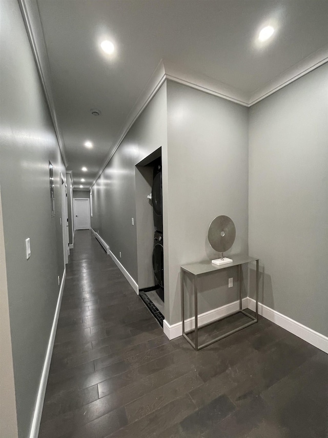 hallway with recessed lighting, baseboards, ornamental molding, and dark wood-style flooring