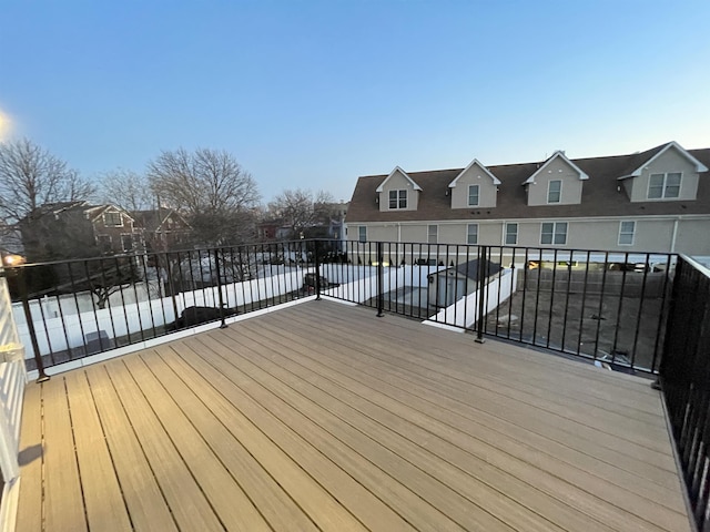 wooden terrace featuring a residential view