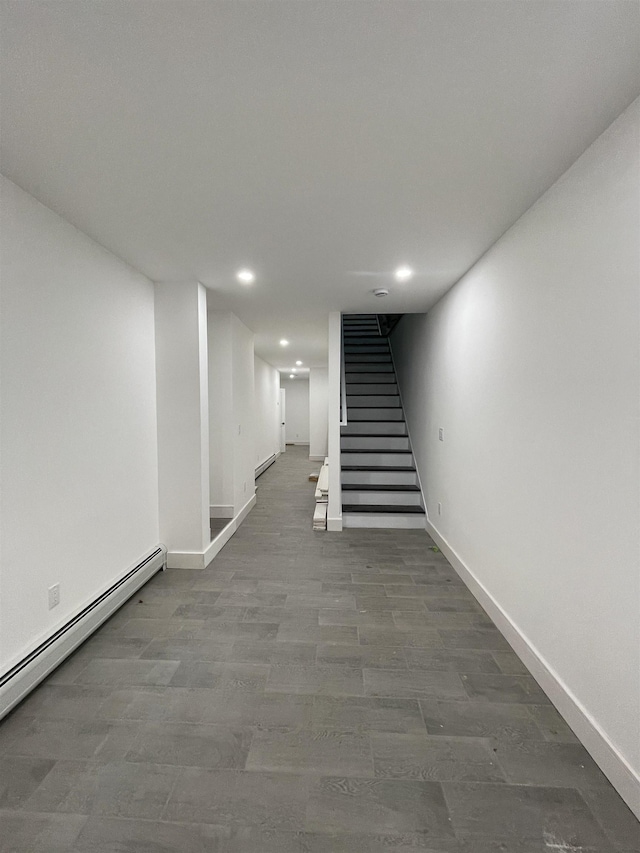 corridor featuring recessed lighting, stairway, baseboards, and baseboard heating