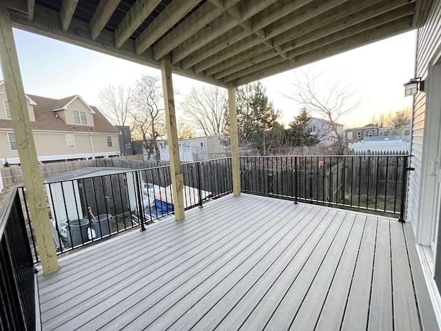 deck featuring a fenced backyard and a residential view