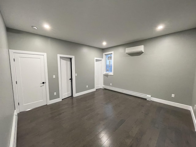 interior space with a baseboard radiator, baseboards, dark wood-style floors, and a wall mounted AC