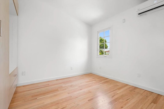 618 17th St, Union City, NJ 07087 - spare room with an AC wall unit and wood finished floors