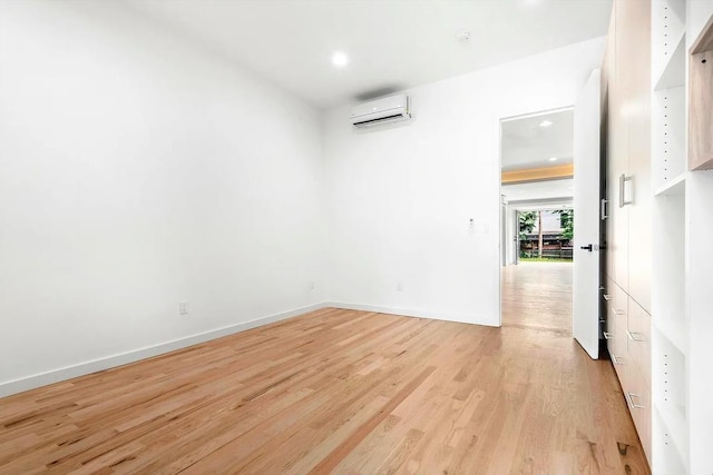 618 17th St, Union City, NJ 07087 - empty room featuring a wall mounted AC, light wood finished floors, and recessed lighting