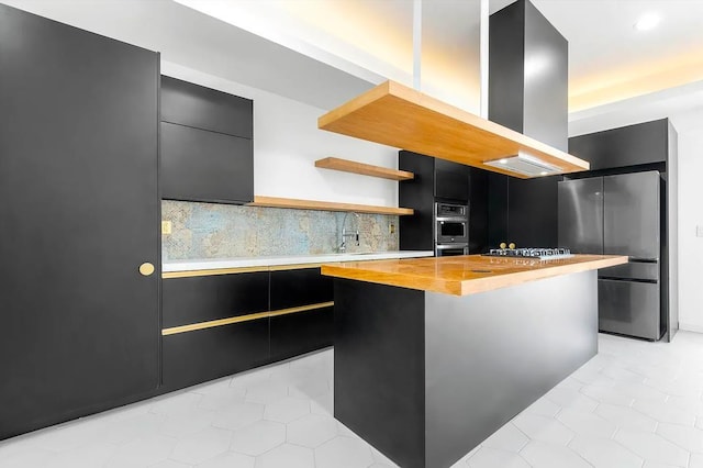 618 17th St, Union City, NJ 07087 - kitchen featuring dark cabinetry, appliances with stainless steel finishes, decorative backsplash, a kitchen island, and open shelves