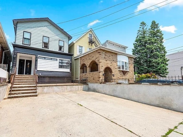 618 17th St, Union City, NJ 07087 - view of front facade with brick siding and covered porch