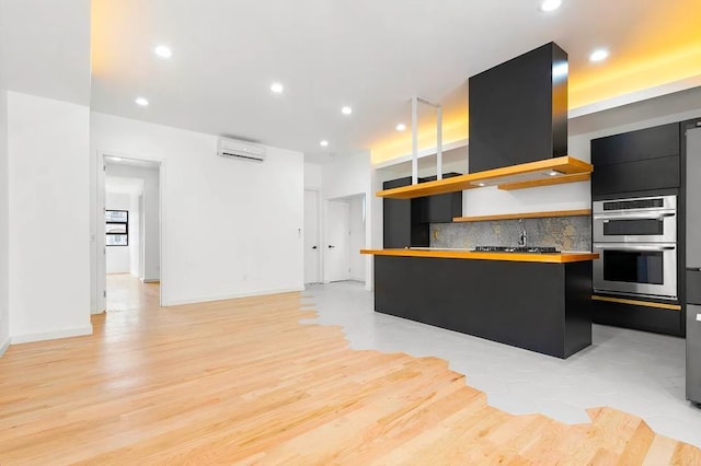618 17th St, Union City, NJ 07087 - kitchen featuring open shelves, butcher block countertops, stainless steel double oven, dark cabinetry, and a wall unit AC