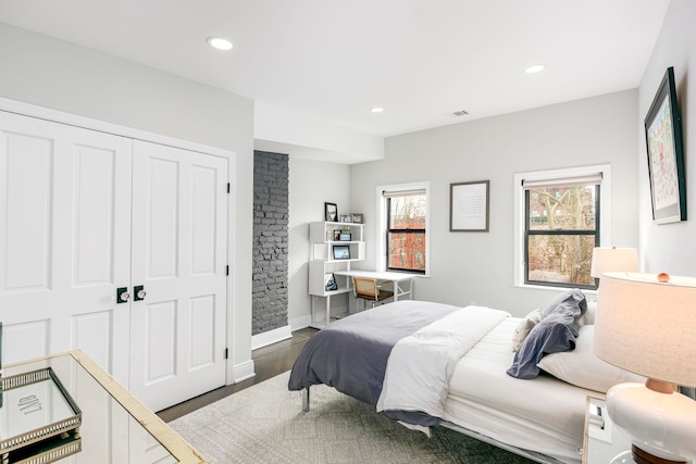 294 4th St, Jersey City, NJ 07302 - bedroom with recessed lighting, a closet, baseboards, and wood finished floors