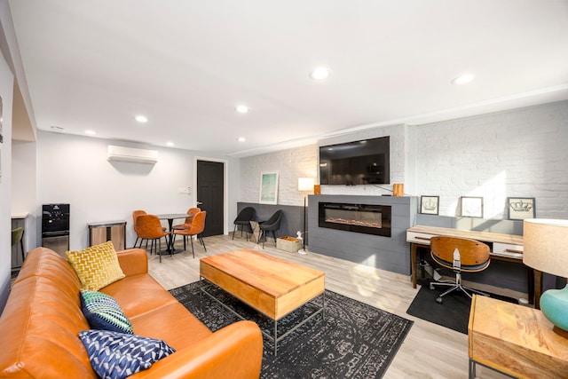 294 4th St, Jersey City, NJ 07302 - living room with recessed lighting, wood finished floors, a glass covered fireplace, and a wall unit AC