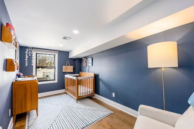 294 4th St, Jersey City, NJ 07302 - bedroom featuring visible vents, baseboards, recessed lighting, and wood finished floors