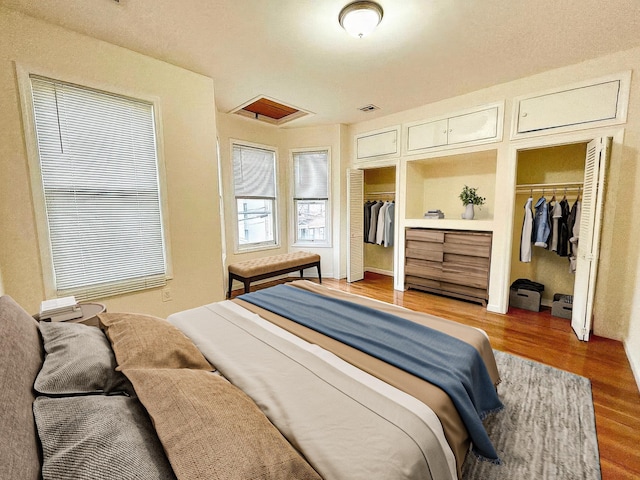 bedroom with hardwood / wood-style flooring