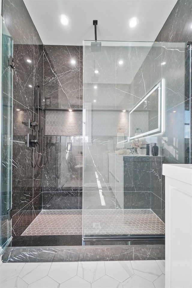 bathroom with a tile shower