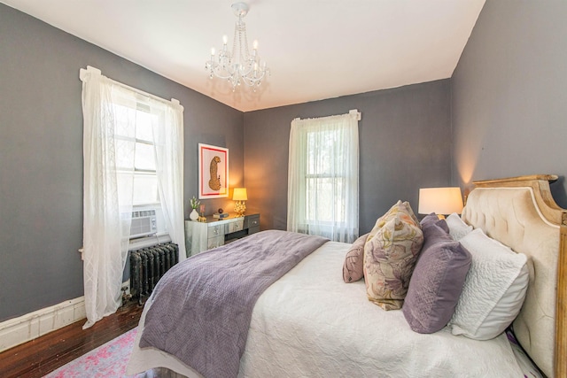 68 Osborne St, Glen Ridge, NJ 07028 - bedroom featuring radiator, a chandelier, multiple windows, and wood finished floors