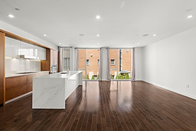 5 Washington Pl, Cliffside Park, NJ 07010 - kitchen featuring modern cabinets, brown cabinets, and dark wood finished floors